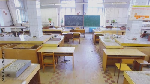 Desks and chalkboard in laboratory of University 