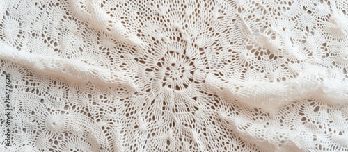 Handmade white openwork fabric, crocheted and knitted.