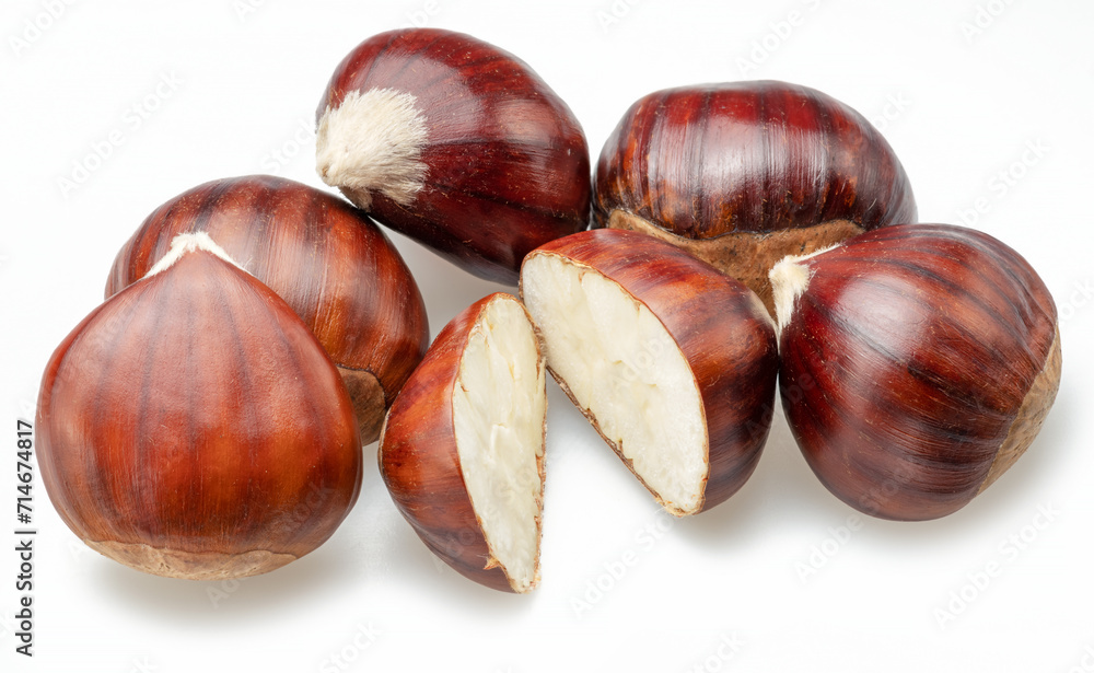 Edible sweet chestnuts with cut chestnut isolated on white background. Edible sweet chestnuts with cut chestnut isolated on white background.