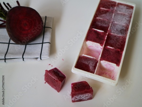  Organic beetroot pulp juice fruits in ice cube trays ready for freezing. Can be used for face mask for healthy skin care., squeezed from a slow juicer, zero waste. photo
