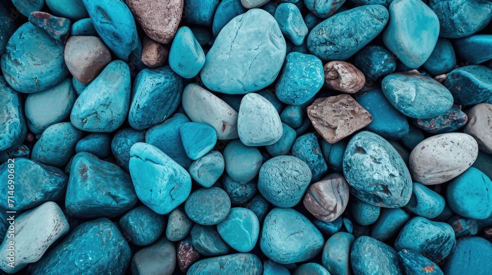 An abstract pattern of colorful rocks and pebbles with natural textures on a beach, ideal for backgrounds. An abstract pattern of colorful rocks and pebbles with natural textures on a beach, ideal for backgrounds.