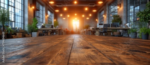 Empty wooden table in front of blurred background of coffee shop with bokeh
