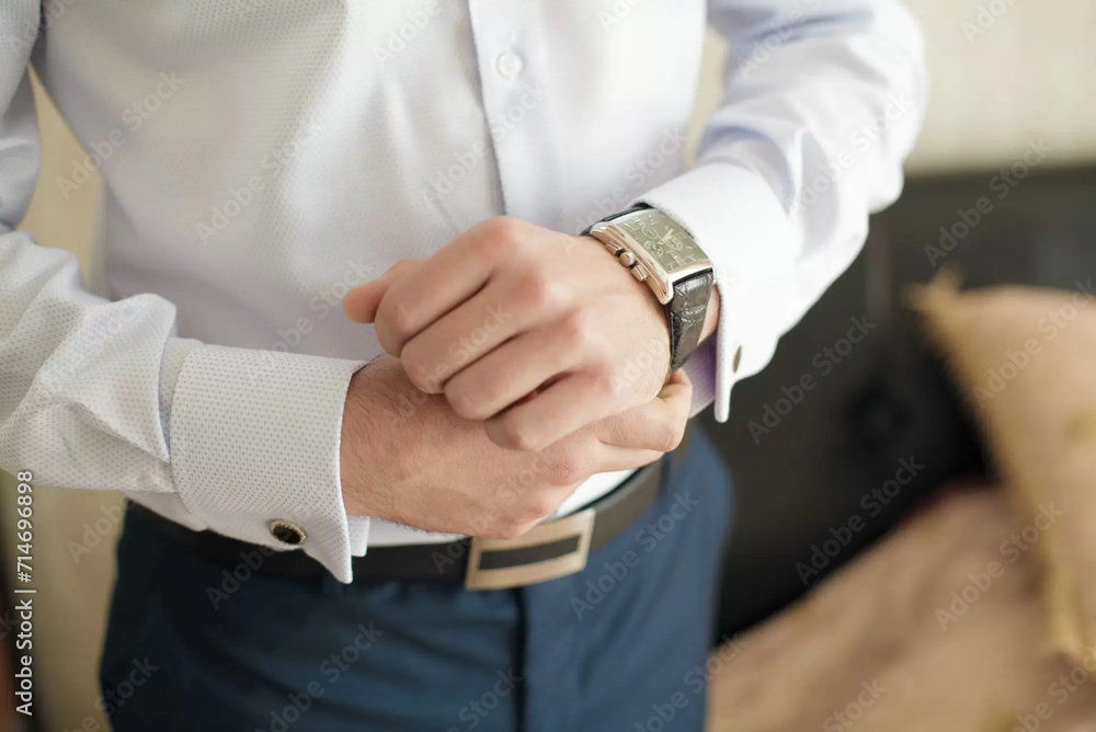 Man holds hand with watch