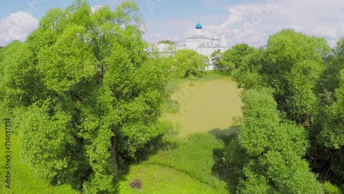 Pond covered by duckweed near Saint Trinity Danilov cloister photo