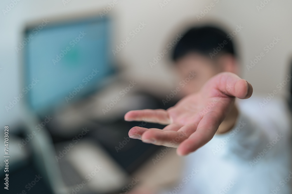 Portrait of a handsome young man showing hand gestures.