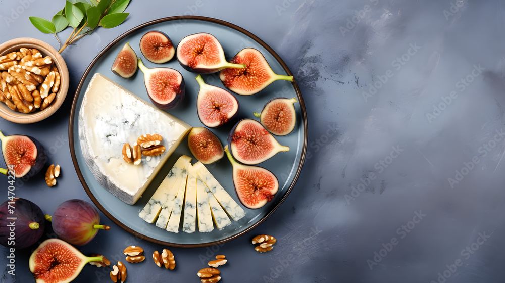 Cheese plate with figs on concrete gray background