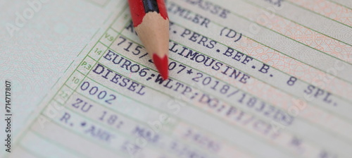 a vehicle registration document with the words (Diesel, Euro 6) and a red pen photo