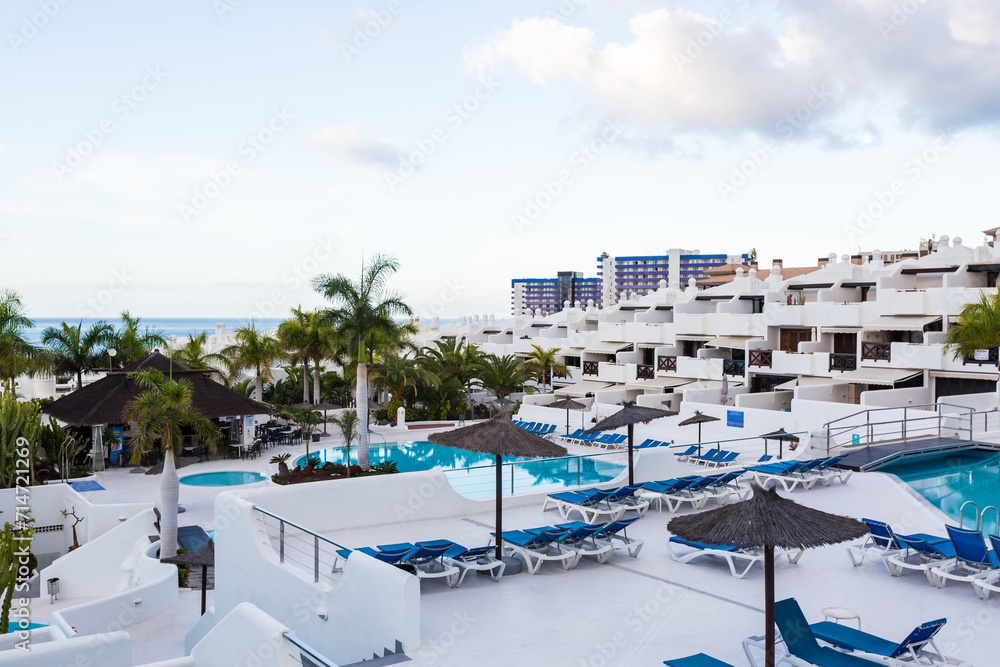 Fototapeta premium swimming pool with empty sun loungers