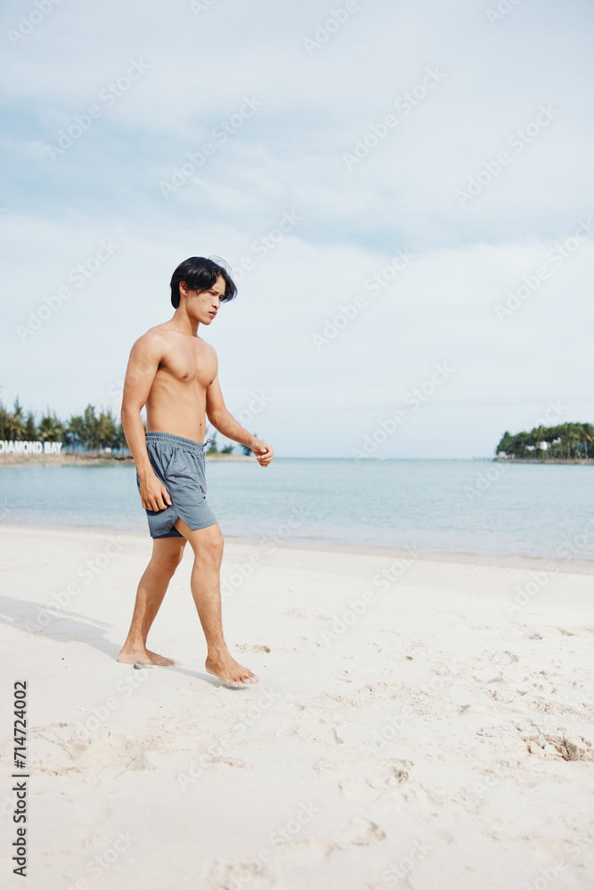 Active Asian Athlete Running on the Beach at Sunset, Exuding Strength and Freedom in a Fit and Healthy Lifestyle Active Asian Athlete Running on the Beach at Sunset, Exuding Strength and Freedom in a Fit and Healthy Lifestyle