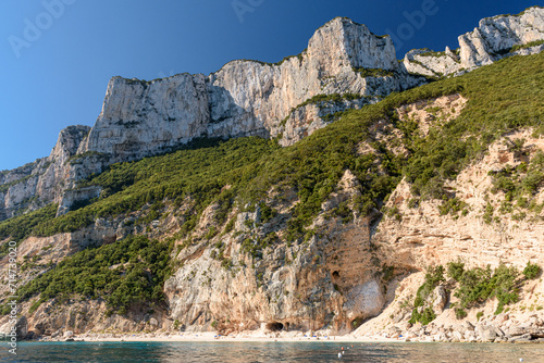 The cliffed coast of the Orosei gulf and the bay Cala dei Gabbiani in east Sardinia seen from the sea