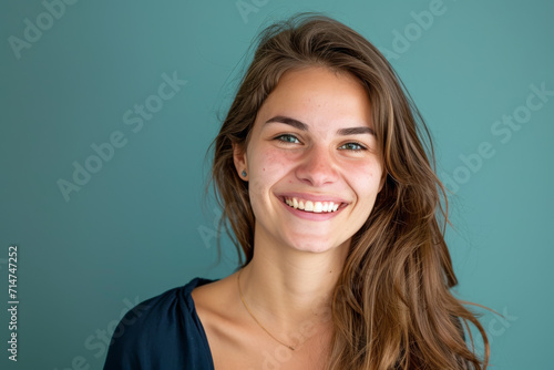 A woman with long brown hair is smiling for the camera © MagnusCort