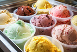Assorted of colorful gelato in a display case, offering a tempting variety of flavors, each scoop perfectly chilled and ready to enjoy.