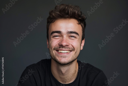 A young man with a beard is smiling and wearing a black shirt © MagnusCort