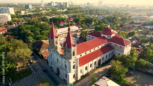 Iloilo City, Philippines - Morning aerial of Molo Church, also known as Saint Anne Parish Church. With the new business district in the background.