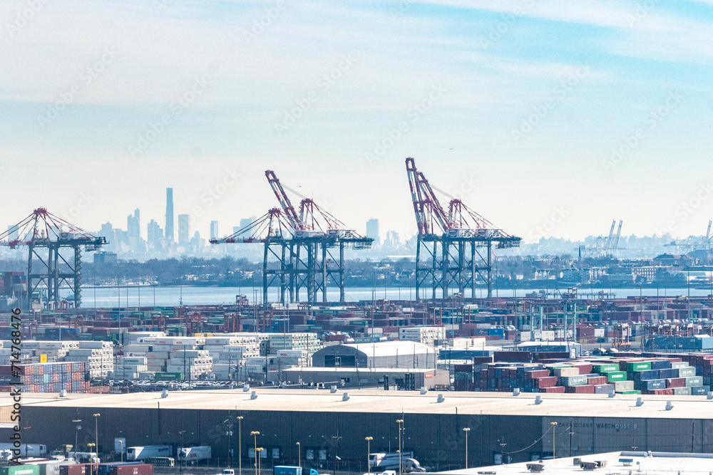Obraz premium Aerial view of Shipping Containers, Newark Bay, Panamax cranes, and the Port of Newark - Elizabeth Marine Terminal run by the Port Authority of Newark and New Jersey