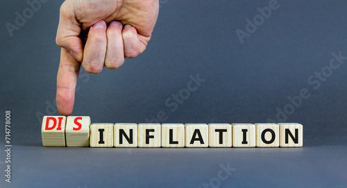 Inflation or disinflation symbol. Concept word Inflation Disinflation on beautiful wooden cubes. Beautiful grey background. Businessman hand. Business inflation disinflation concept. Copy space.