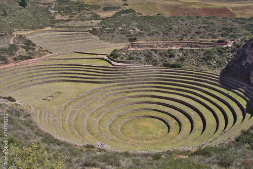 Maras, Peru – May 27 2018: Located in the Sacred Valley, Peru, the Incan ruins of Moray are composed of three groups of circular terraces believed to be be used for agricultural experimentation.  © Nancy
