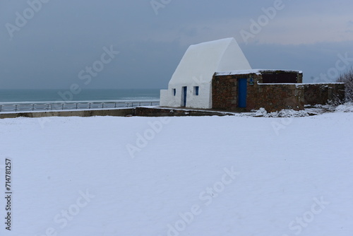 Jersey, U.K. Snow at St.Ouens Bay with 19th century fort.