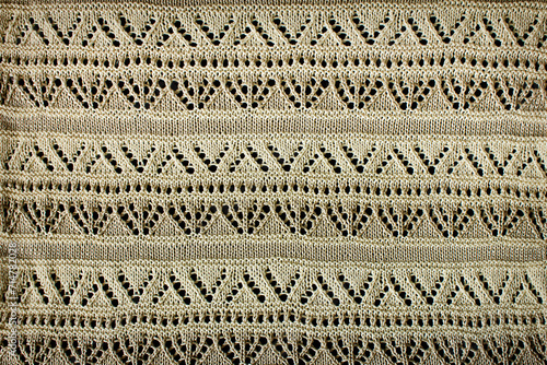 white background knitted openwork material with close-up pattern photo