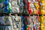 Bales of compacted mixed recyclables awaiting processing