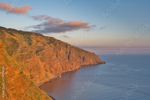 Ponta do Pargo Madeira, Portugal – July 29 2023: A summer sunset at Ponta do Pargo lighthouse, with the cliffs bathed in a warm glow.  photo
