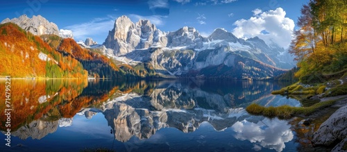 Stunning autumn scene with Dachstein summit mirrored in Gosausee lake in Upper Austria's Salzkammergut.