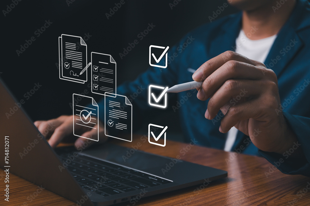 Checklist concept, Businessman mark checkboxes, Survey form, check marks on checklist, filling online form and answering questions. List options business employee security procedures followed office. - obrazy, fototapety, plakaty 