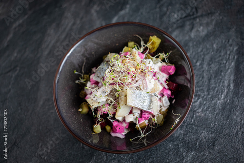 herring salad with baked beets and pickled cucumbe photo