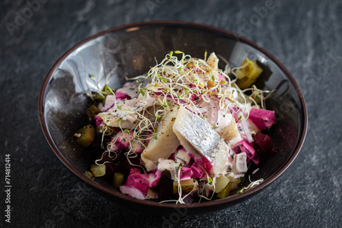 herring salad with baked beets and pickled cucumbe photo