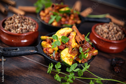 tagine with squash and dates with buckwheat in a pan