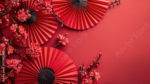 Chinese New Year celebration background with red paper fans and flowers. Asia traditional cultural decoration. Empty space. decoration backdrop idea