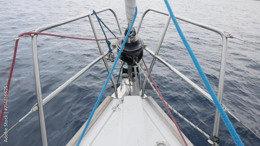 Front deck of white yacht during movement on background of ocean water surface. Deck of white yacht while moving on background of ocean water surface. Front deck of white yacht during movement on background of ocean water surface. Deck of white yacht while moving on background of ocean water surface.