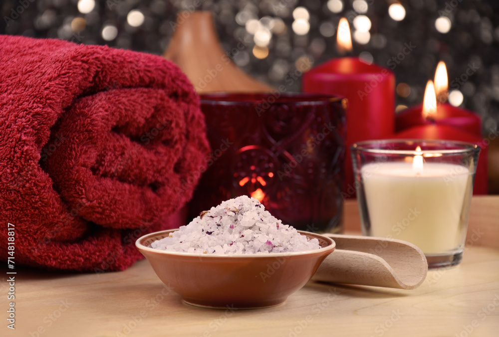 Bath salt, red towel and candle on wooden background spa still life stock photo images. Romantic spa and wellness setting with towel, bath salt and red candles photo. Beauty spa treatment composition