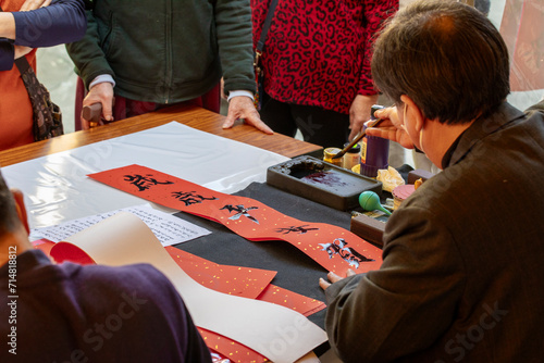 China, Spring Festival, calligrapher, handwritten Spring Festival couplets, brush characters, Chinese Spring Festival,