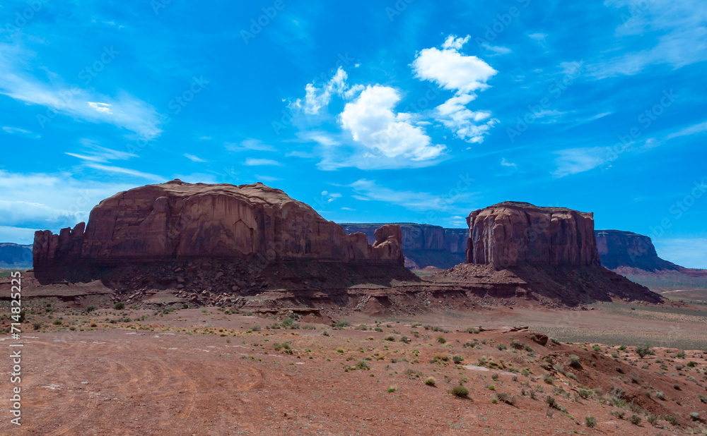 Arizona landscape, red eroded sandstone cliffs and Sand dunes desert of Monument Valley, Arizona - Utah