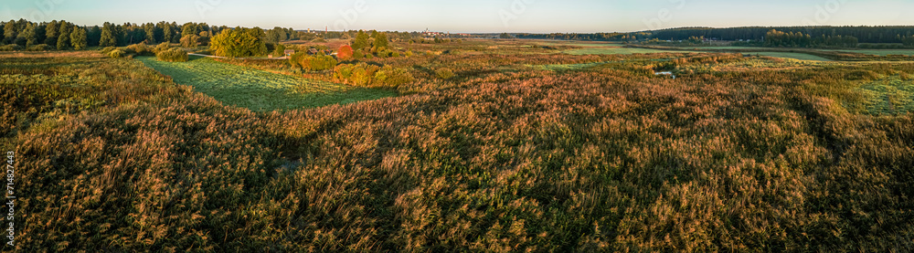 Sunrise among meadows and forests on the Suprasl River in Podlasie on an autumn,september day.
