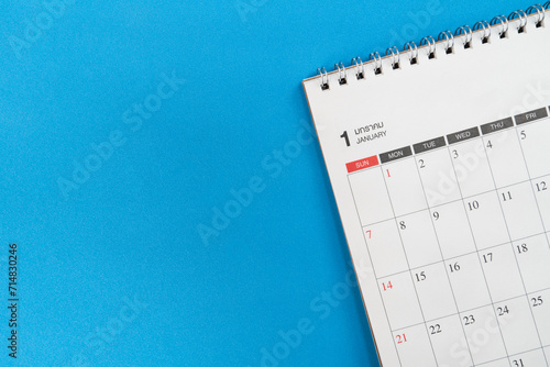 close up of calendar on the blue table background, planning for business meeting or travel planning concept © tatomm