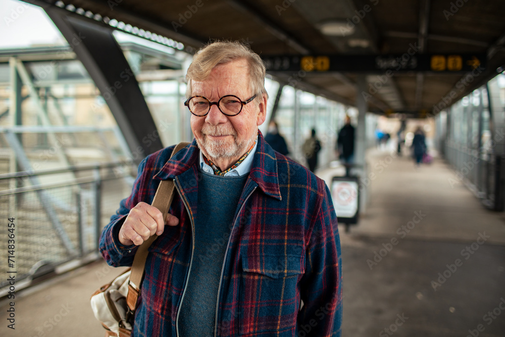 Portrait of a traveling senior man at the train station Portrait of a traveling senior man at the train station
