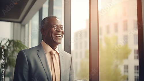 African senior business man looking at the window