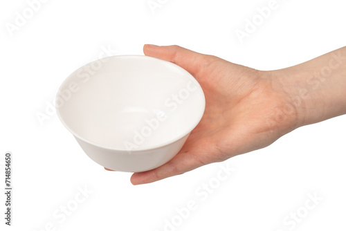 Photography Female hand is holding a ceramic bowl isolated on white background