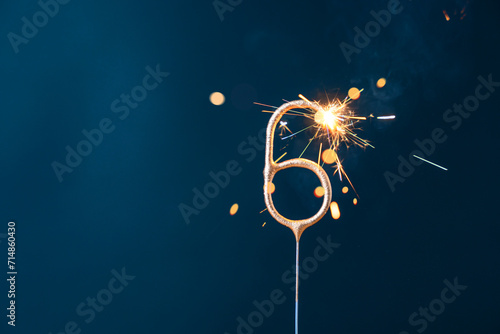 6 years celebration festive background made with Bengal fire in the form of number Six. photo
