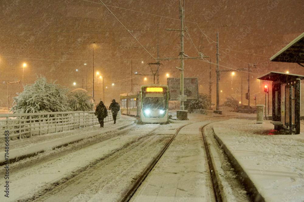 People in traffic through snow in Bucharest, Romania 20 ianuary