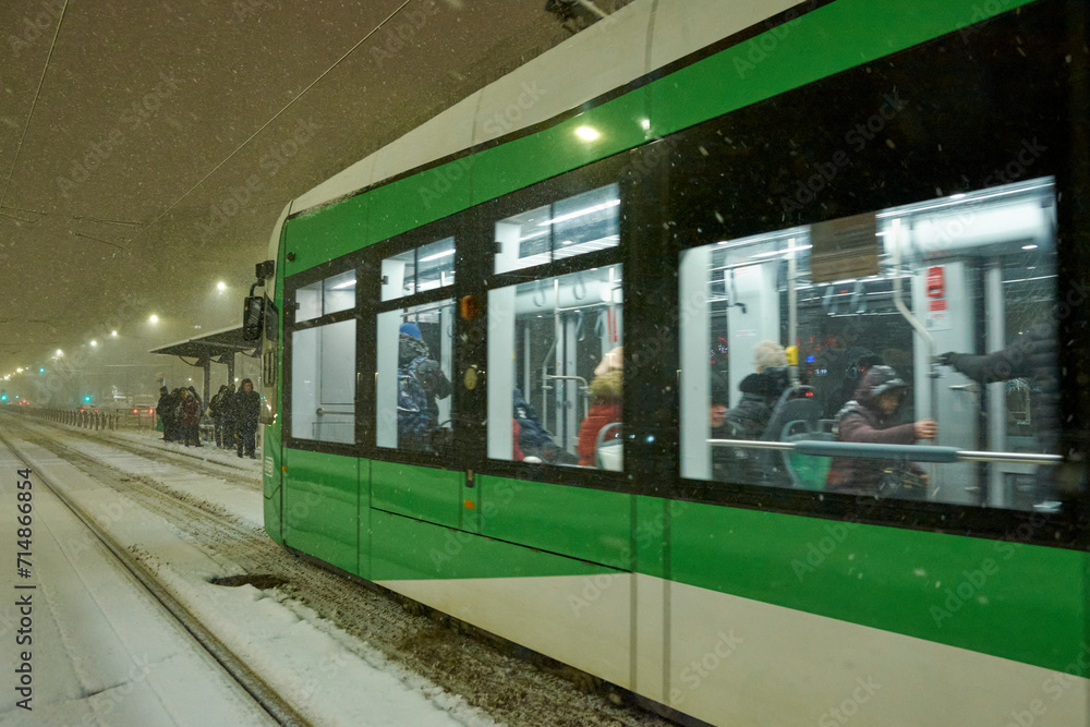 People in traffic through snow in Bucharest, Romania, January 20, 2024
