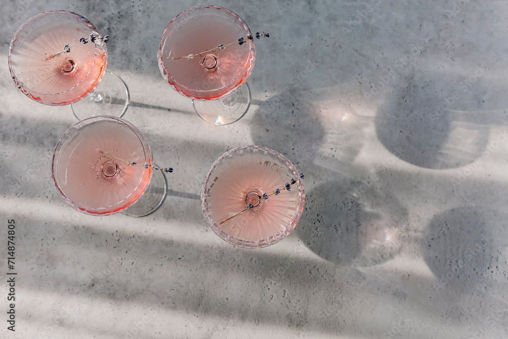 Glasses with cold pink champagne placed on table