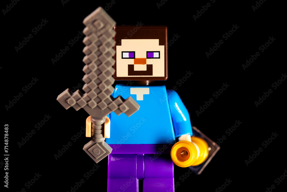 Naklejka premium LEGO Minecraft Steve with a sword on a black background
