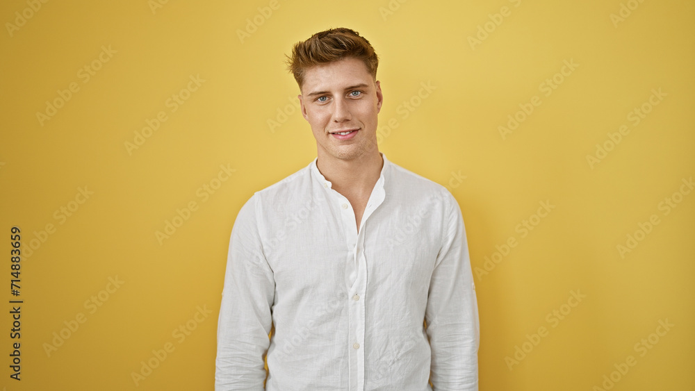 Laughing, confident young caucasian man in casual fashion, standing isolated against a yellow background, radiating positive vibes and joy Laughing, confident young caucasian man in casual fashion, standing isolated against a yellow background, radiating positive vibes and joy