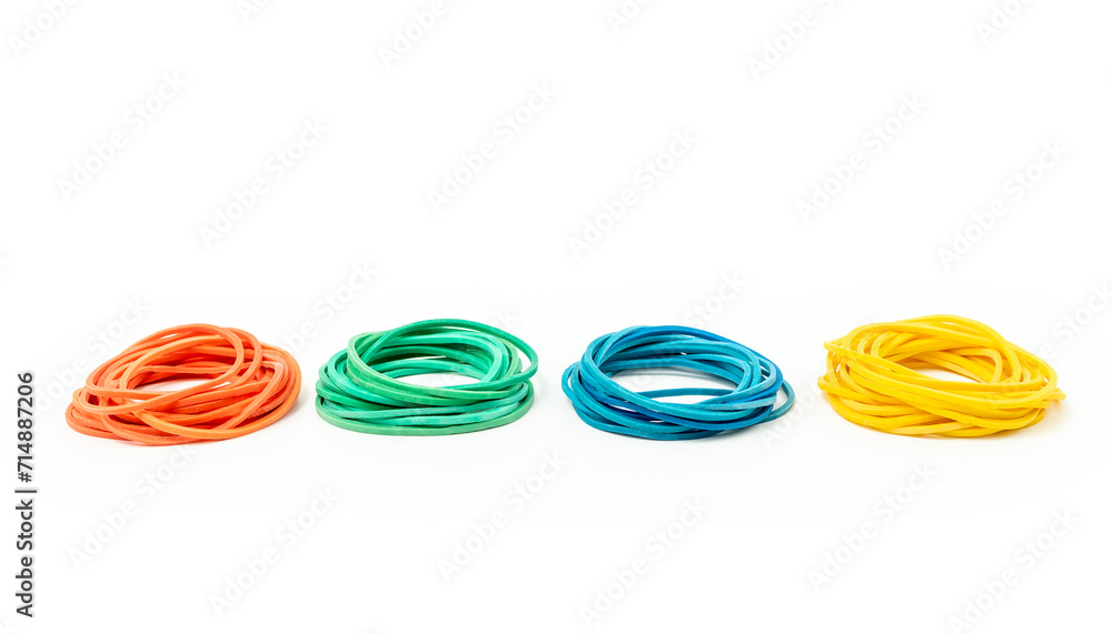 Stacks of different rubber bands on white background. Red, green, blue and yellow rubber bands Stacks of different rubber bands on white background. Red, green, blue and yellow rubber bands