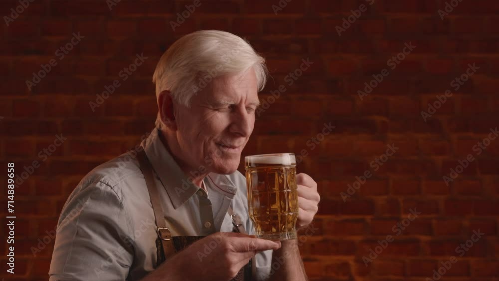 adult blond brewer inspects and tasting fresh beer adult blond brewer inspects and tasting fresh beer