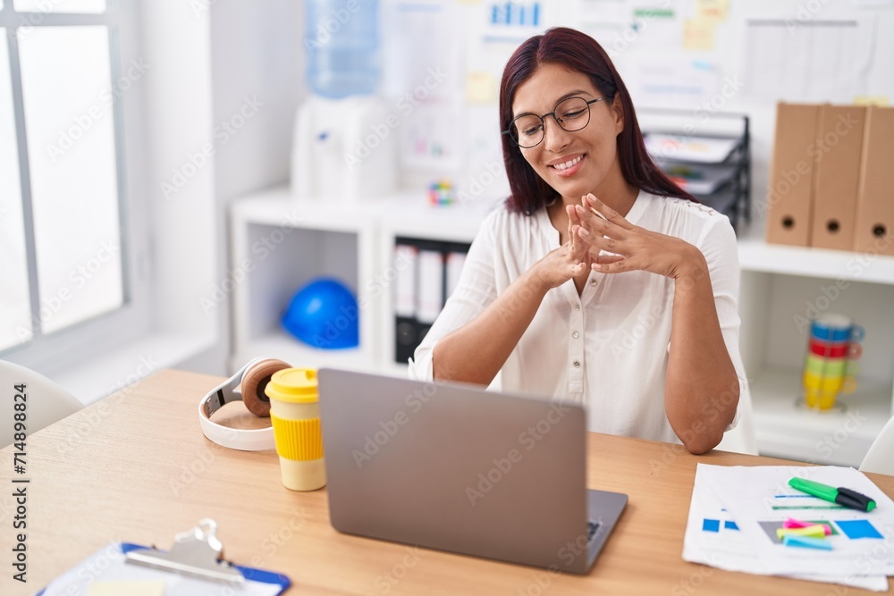 Young beautiful hispanic woman business worker using having video call at office Young beautiful hispanic woman business worker using having video call at office