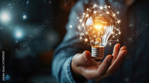 Businessman hand holding creative light bulb with industry network, analysis solution and development marketing network icons planning strategy, Modern business, Innovative of new ideas photo